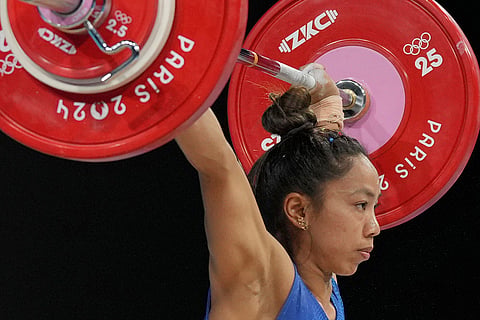 India's Mirabai Chanu Saikhom competes during the women's 49kg weightlifting